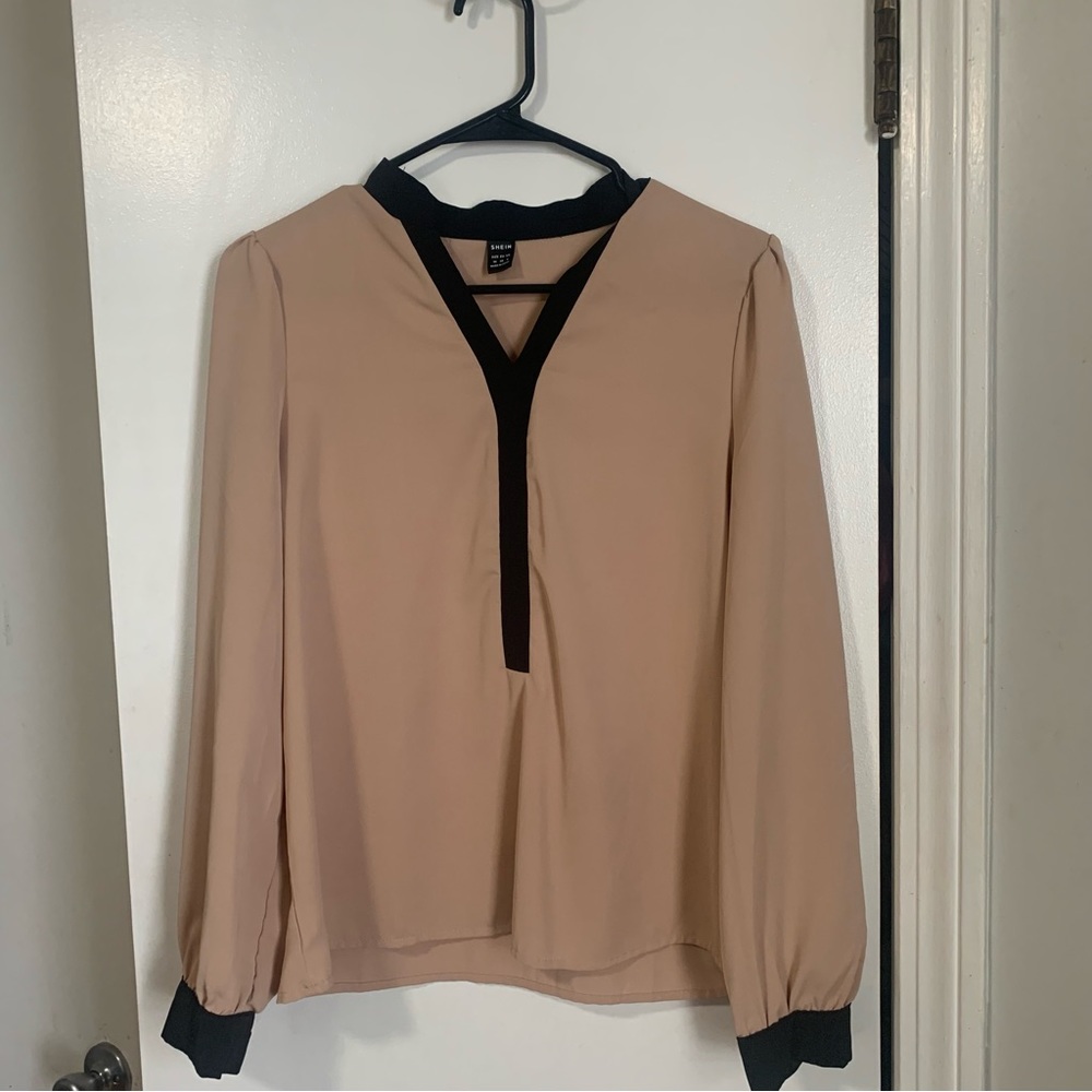 Womens medium tan blouse with black trim. Never worn